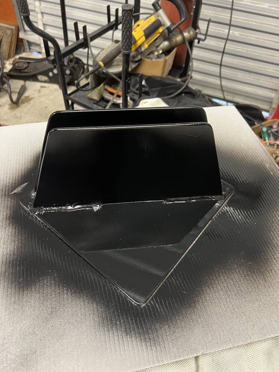 Finished custom steel bracket welded and painted black